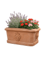 Jardinière ovale en terracotta d’Impruneta avec décor fruitier et rosettes